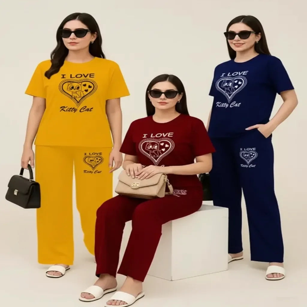Three women wearing matching outfits with 'I Love Kitty Cat' text and graphics on a plain background.